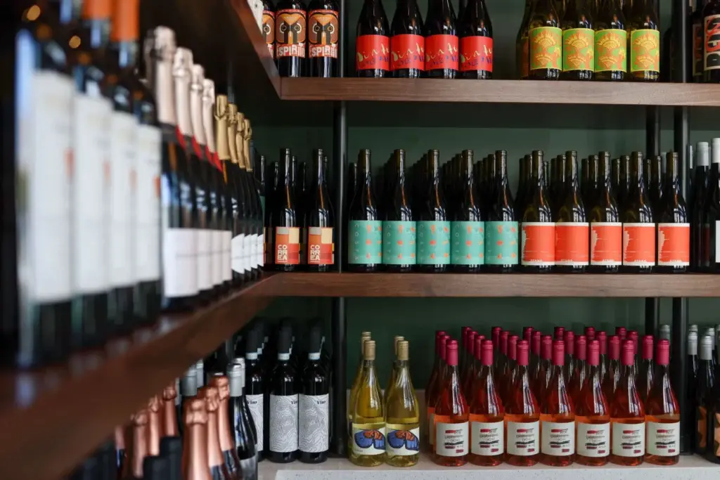 Postino Little Italy wine bar with exposed brick and long communal tables